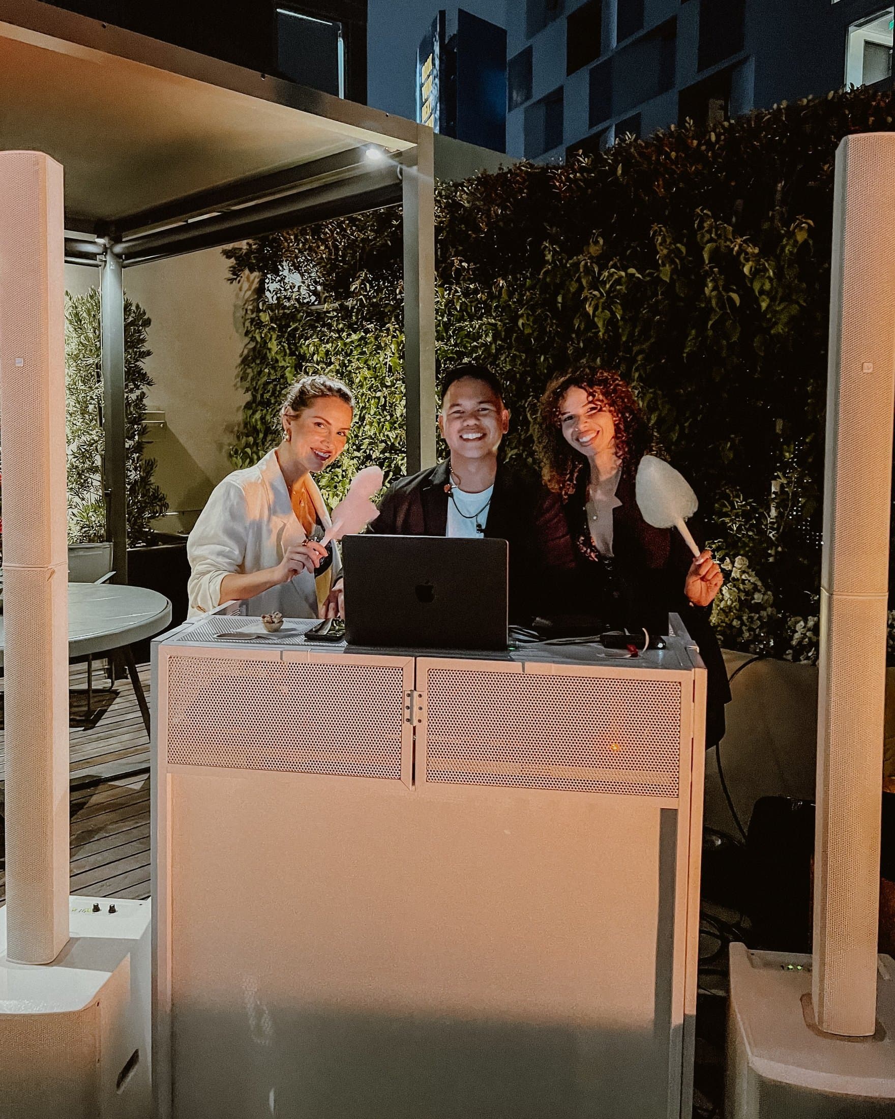 DJ MOJOE with guests at a rooftop private event
